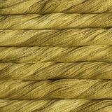 close up view of malabrigo silkpaca lace weight yarn color golden yellow