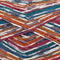 Close up of self striping yarn color red orange green blue white