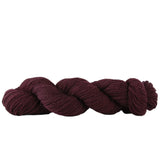 Braided burgundy yarn on a white background