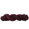 Braided burgundy yarn on a white background