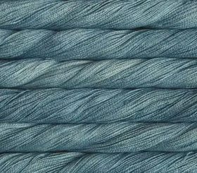 close up view of malabrigo silkpaca lace weight yarn color blue