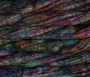 close up view of malabrigo silkpaca lace weight yarn color red teal yellow purple speckles