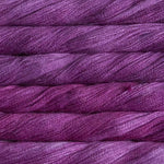 close up view of malabrigo silkpaca lace weight yarn color magenta