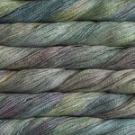 close up view of malabrigo silkpaca lace weight yarn color yellow grey blue light purple