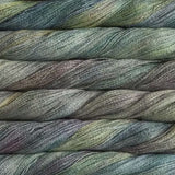 close up view of malabrigo silkpaca lace weight yarn color yellow grey blue light purple