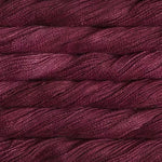 close up view of malabrigo silkpaca lace weight yarn color red