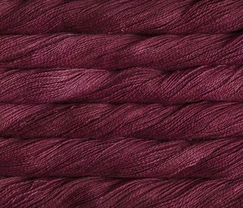 close up view of malabrigo silkpaca lace weight yarn color red