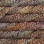 close up view of malabrigo silkpaca lace weight yarn color yellow brown orange green burgundy