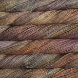 close up view of malabrigo silkpaca lace weight yarn color yellow brown orange green burgundy