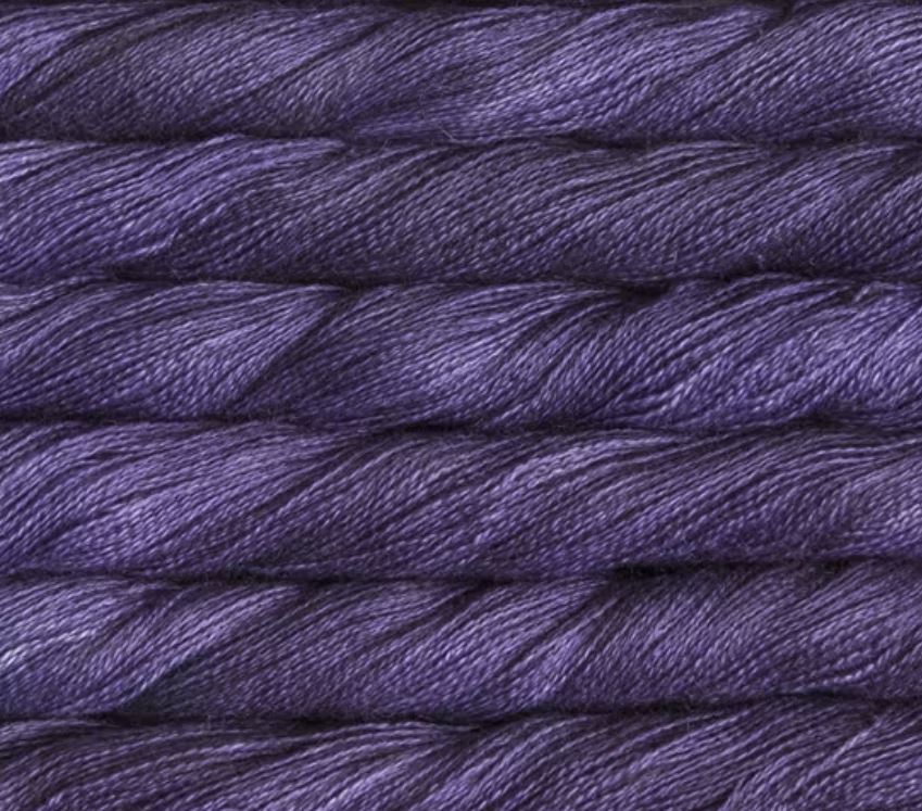 close up view of malabrigo silkpaca lace weight yarn color purple