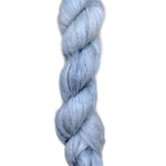 Skein of superkid mohair silk lace weight yarn color icy blue