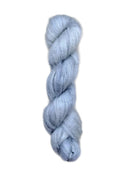 Skein of superkid mohair silk lace weight yarn color icy blue