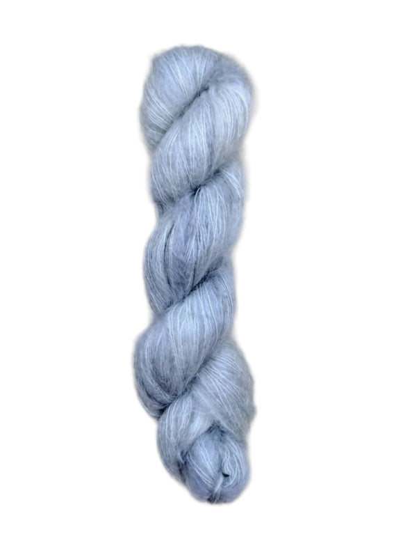 Skein of superkid mohair silk lace weight yarn color icy blue