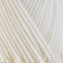 Detailed view of a skein of superwash wool yarn, showcasing a white hue.