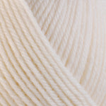 Detailed view of a skein of superwash wool yarn, showcasing a white hue.