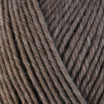 Detailed view of a skein of superwash wool yarn, showcasing a brown hue.