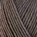 Detailed view of a skein of superwash wool yarn, showcasing a brown hue.