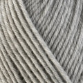 Detailed view of a skein of superwash wool yarn, showcasing a grey hue.