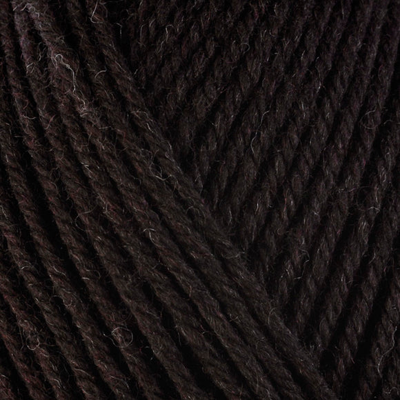 Detailed view of a skein of superwash wool yarn, showcasing a chocolate brown hue.