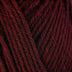 Detailed view of a skein of superwash wool yarn, showcasing a deep red hue.