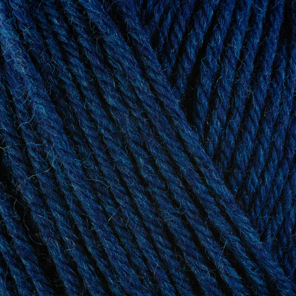 Detailed view of a skein of superwash wool yarn, showcasing a blue hue.