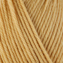 Detailed view of a skein of superwash wool yarn, showcasing a yellow hue.