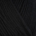 Detailed view of a skein of superwash wool yarn, showcasing a black hue.