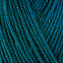 Detailed view of a skein of superwash wool yarn, showcasing a teal hue.