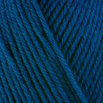 Detailed view of a skein of superwash wool yarn, showcasing a blue hue.