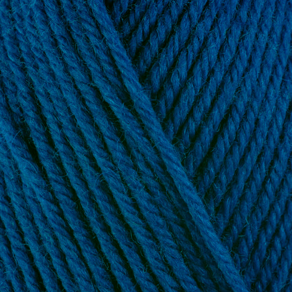 Detailed view of a skein of superwash wool yarn, showcasing a blue hue.