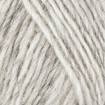 A close up photo of light gray Istex  Lettlopi yarn