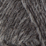 A close up photo of dark gray Istex Lettlopi yarn