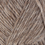 A close up photo of light brown Istex Lettlopi yarn