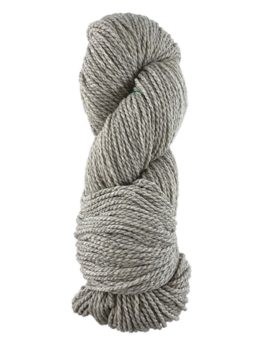 A light grey skein of Mountain Meadow Wool Laramie Natural yarn