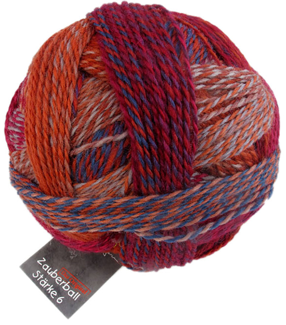 A photo of a colorful ball of Schoppel Zauberball Starke 6 yarn
