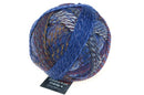 A photo of a colorful ball of Schoppel Zauberball Starke 6 yarn
