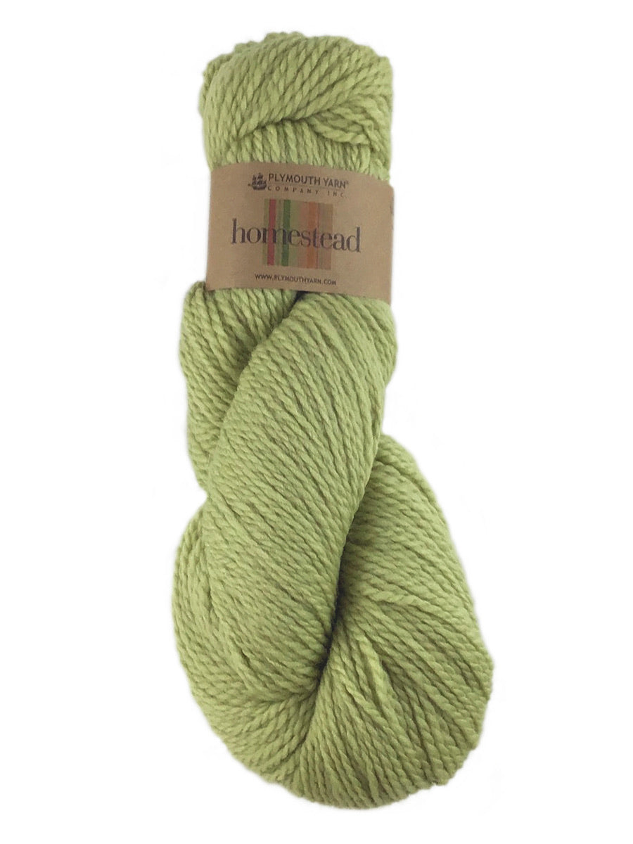 A green skein of Plymouth Homestead yarn