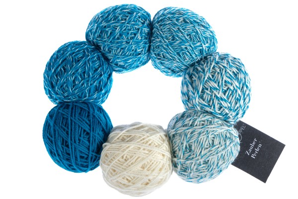 A blue and white set of Schoppel Zauber Perlen yarn balls