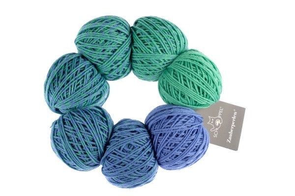 A blue and green set of Schoppel Zauber Perlen yarn balls