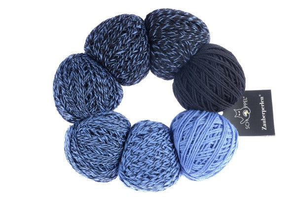 A light blue and navy set of Schoppel Zauber Perlen yarn balls