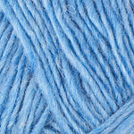 A close up photo of blue Istex Lettlopi yarn