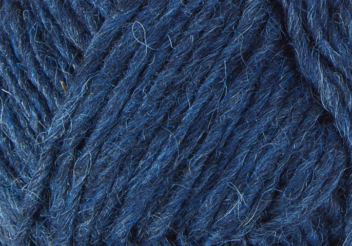 A close up photo of blue Istex Lettlopi yarn