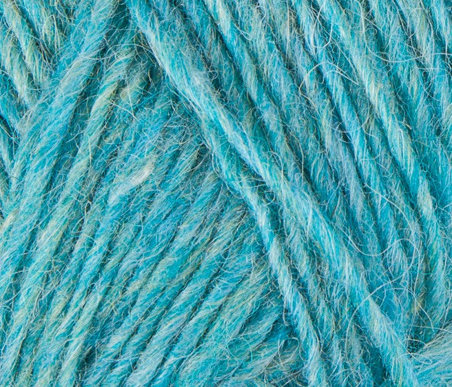 A close up photo of blue Istex Lettlopi yarn