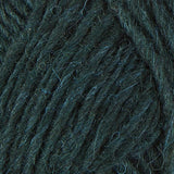 A close up photo of dark green Istex Lettlopi yarn