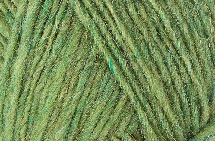 A close up photo of light green Istex Lettlopi yarn