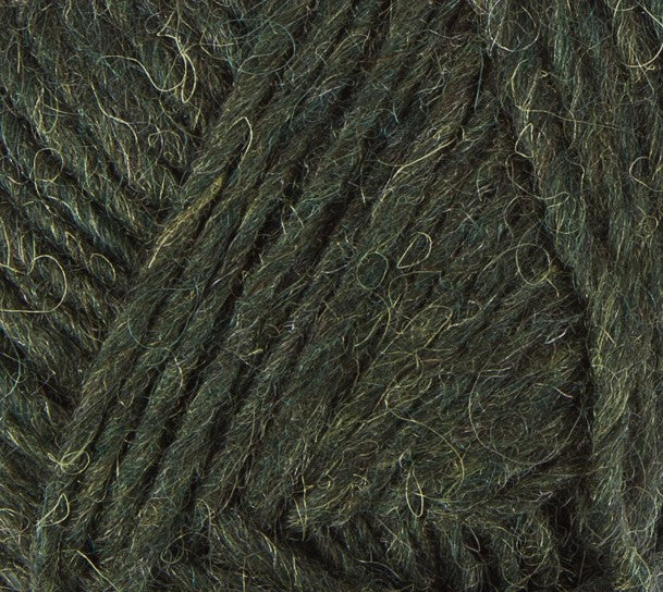 A close up photo of dark green Istex Lettlopi yarn