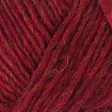 A close up photo of red Istex Lettlopi yarn