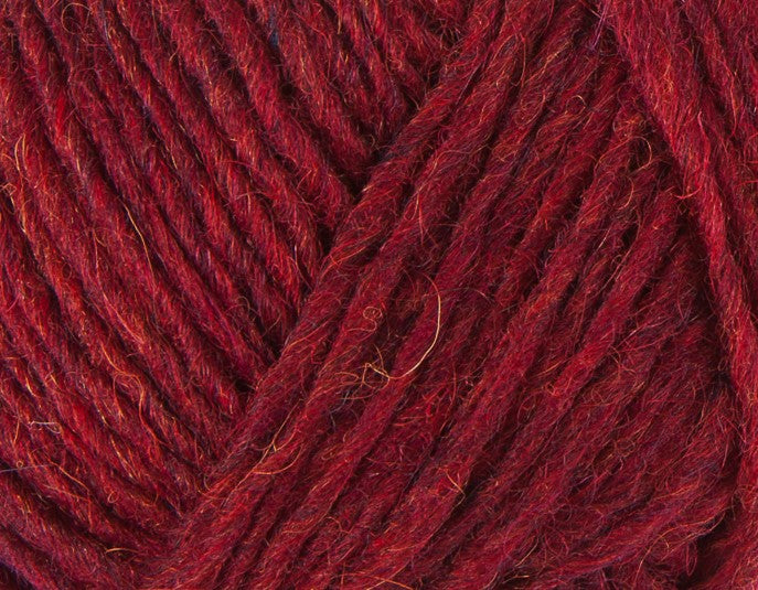A close up photo of red Istex Lettlopi yarn