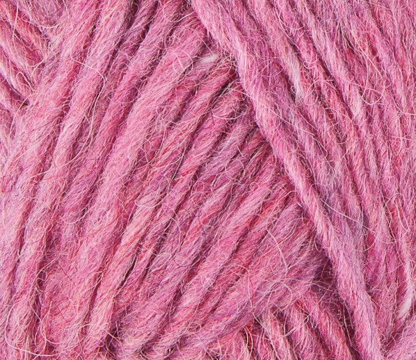 A close up photo of pink Istex Lettlopi yarn