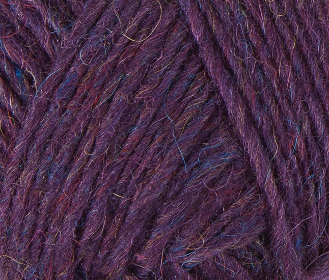A close up photo of purple Istex Lettlopi yarn